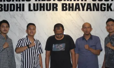 Dika, pelaku penipuan tertunduk di Polres Merangin. (DETAIL/ist)