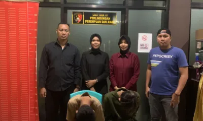 Dua remaja yang diduga pelaku TPPO tertunduk usai dibekuk Tim Elang Polres Merangin. (DETAIL/ist)