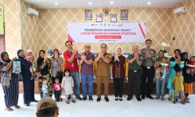 Pemberian makanan sehat dari UPZ Baznas Telkom Regional 1 keada 30 anak di Kecamatan Medan Timur.