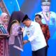 Gubernur Al Haris saat mengukuhkan Hj. Hesnidar Haris sebagai Bunda Literasi (ist)