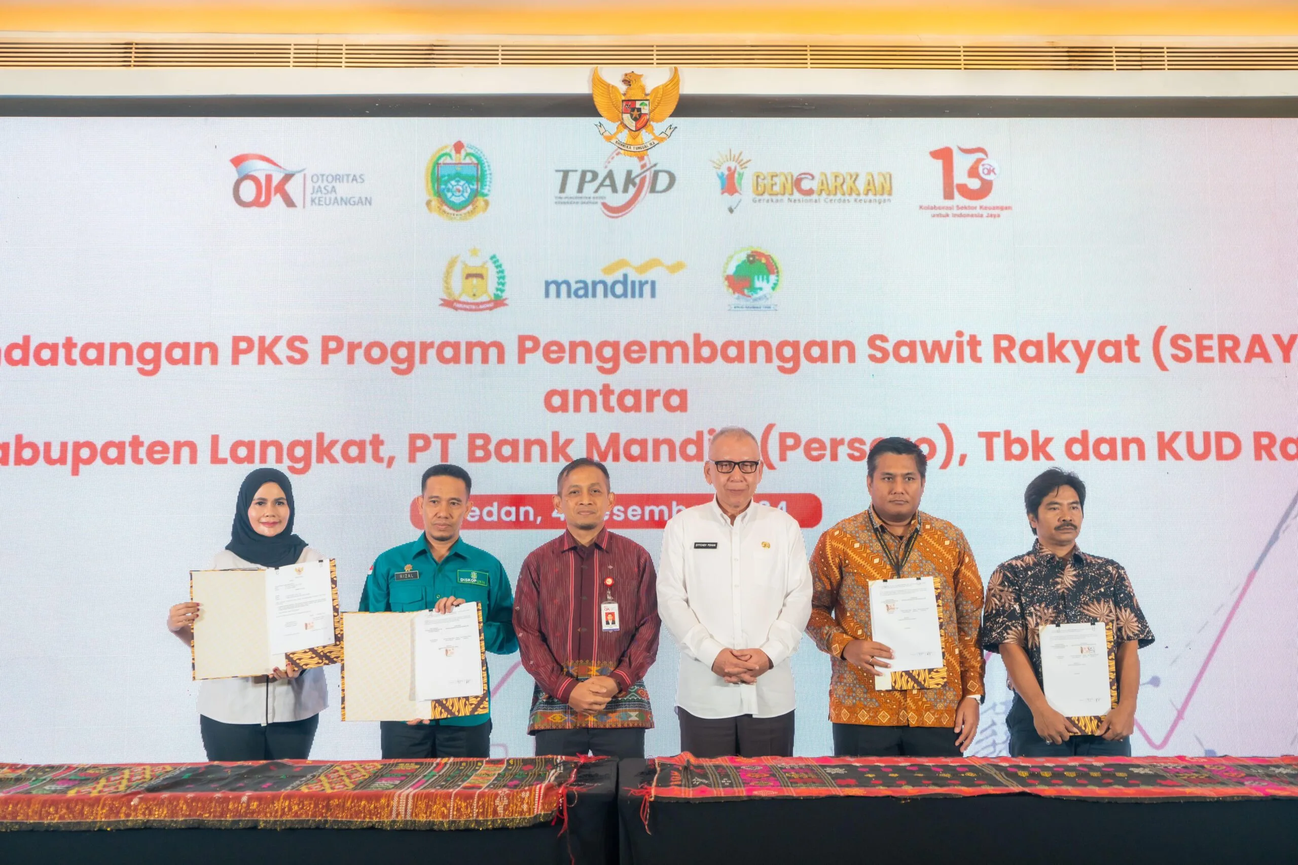 OJK Sumut menggelar penguatan kapasitas TPAKD sekaligus penandatanganan kerjasama untuk penguatan perkebunan kelapa sawit rakyat, Kamis, 5 Desember 2024. (ist)